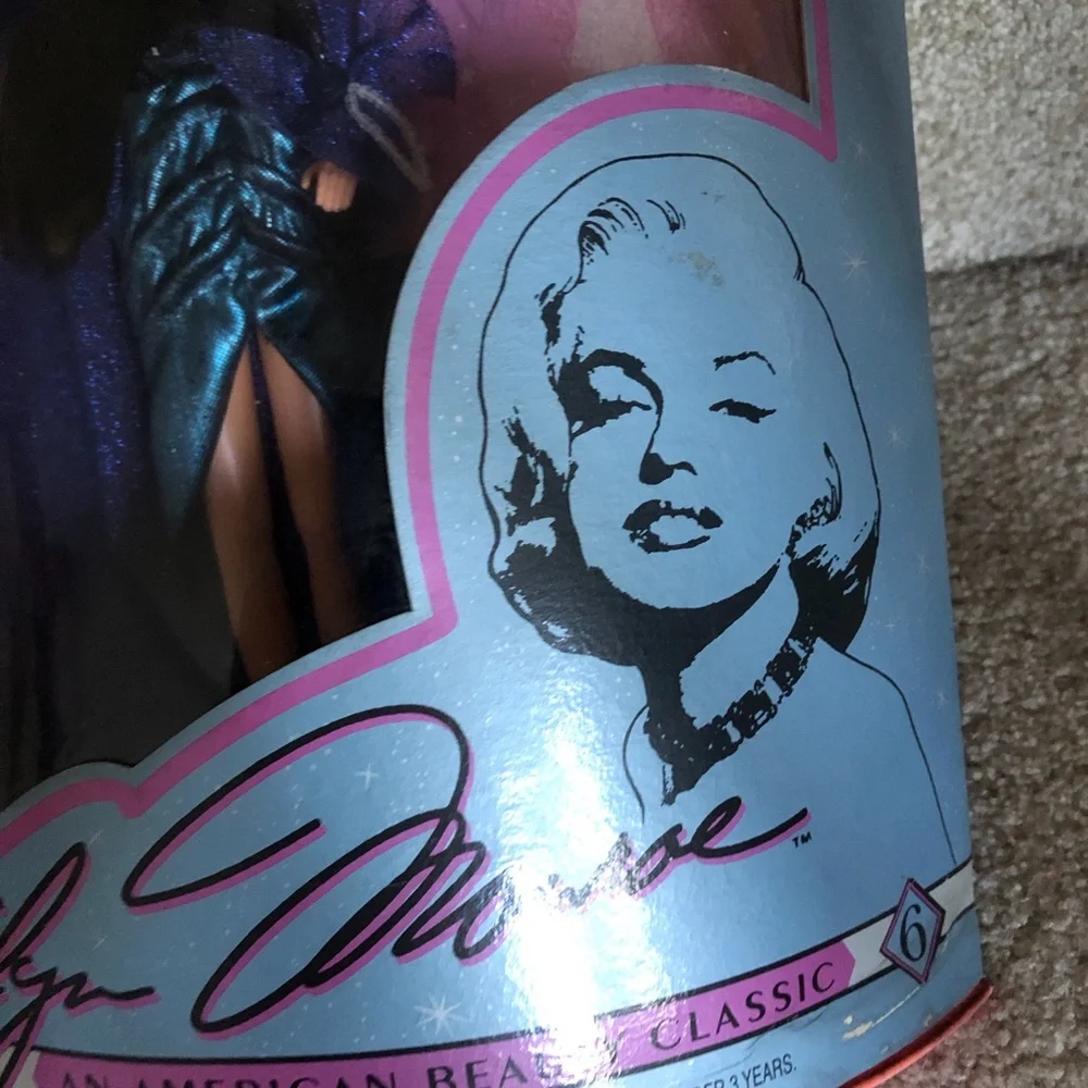 Marilyn Monroe Collector's Series Doll in Blue & Purple Feathered Gown